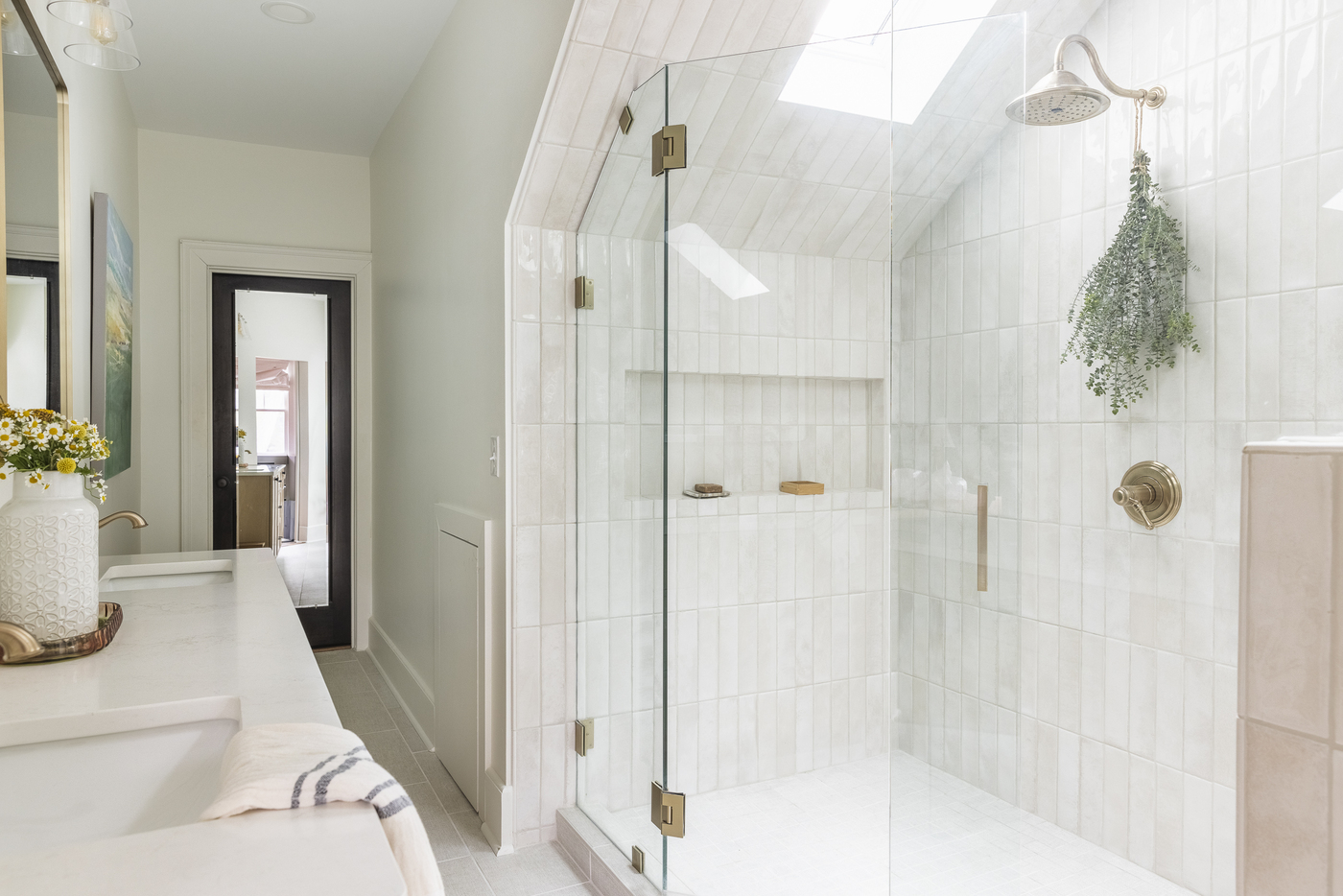 Renovated Hillsboro bathroom with a freestanding tub and tiled surround