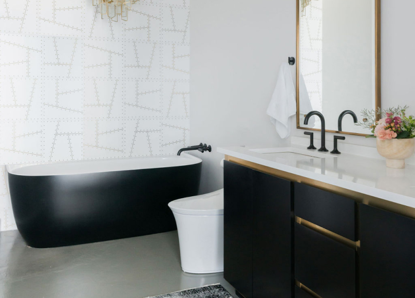 Remodeled bathroom with a freestanding tub and custom vanity